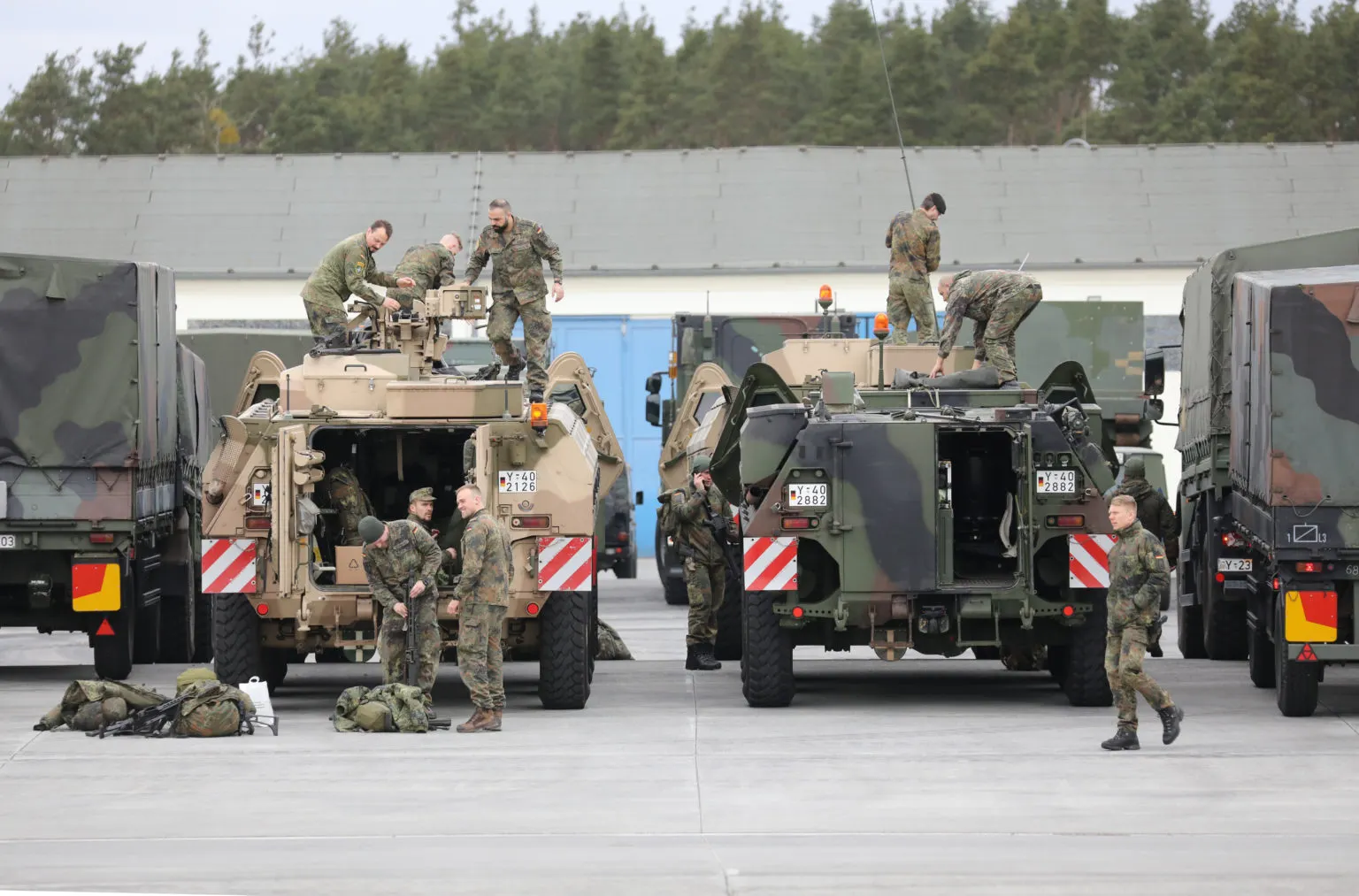How would conscription in Germany impact dual nationals and foreigners?