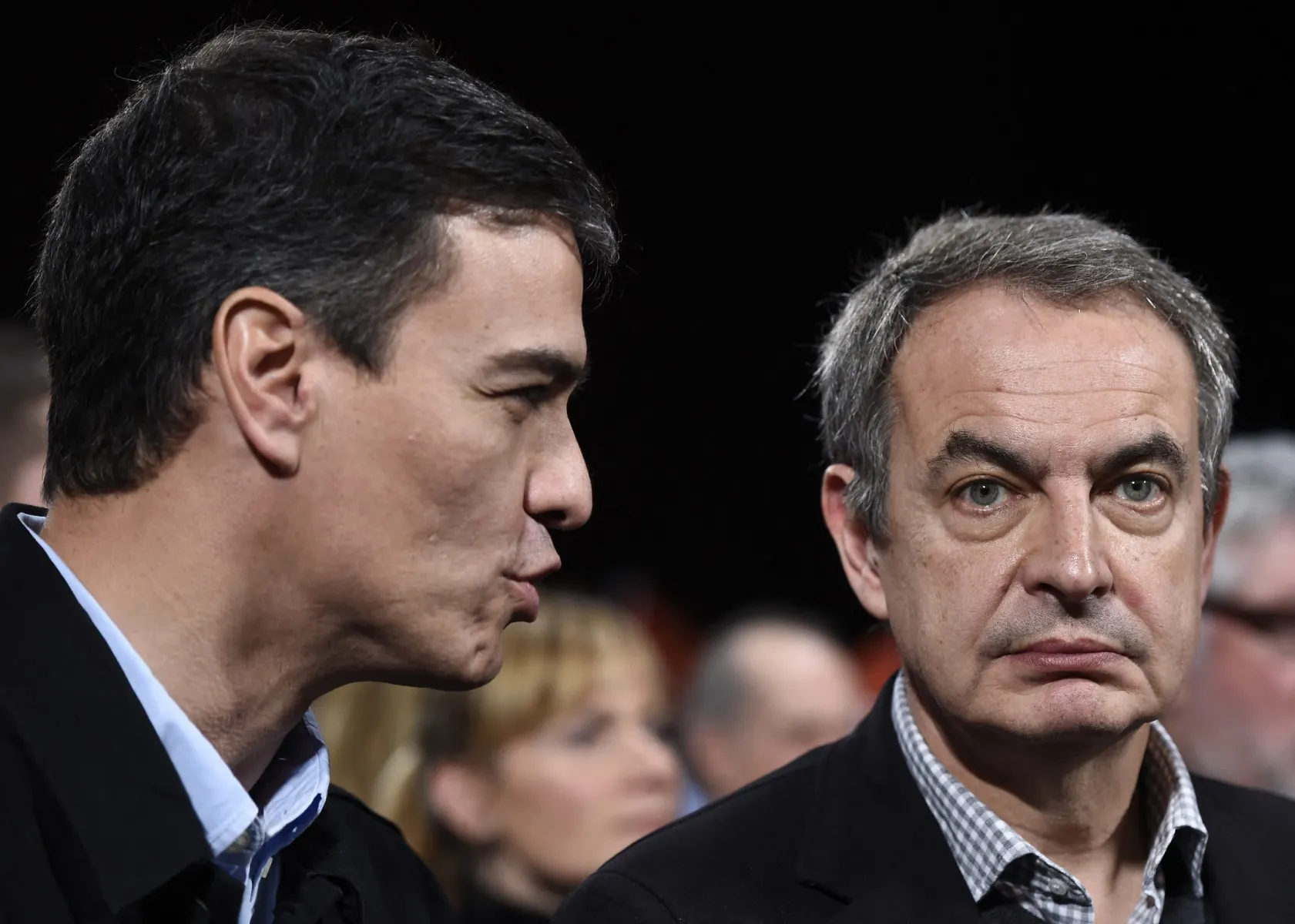Spain's PM keeps backing ex-leader targeted in corruption probe