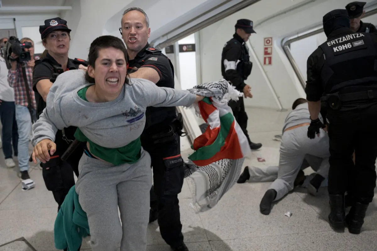 Four held after clashes at Spain airport as Gaza activists return