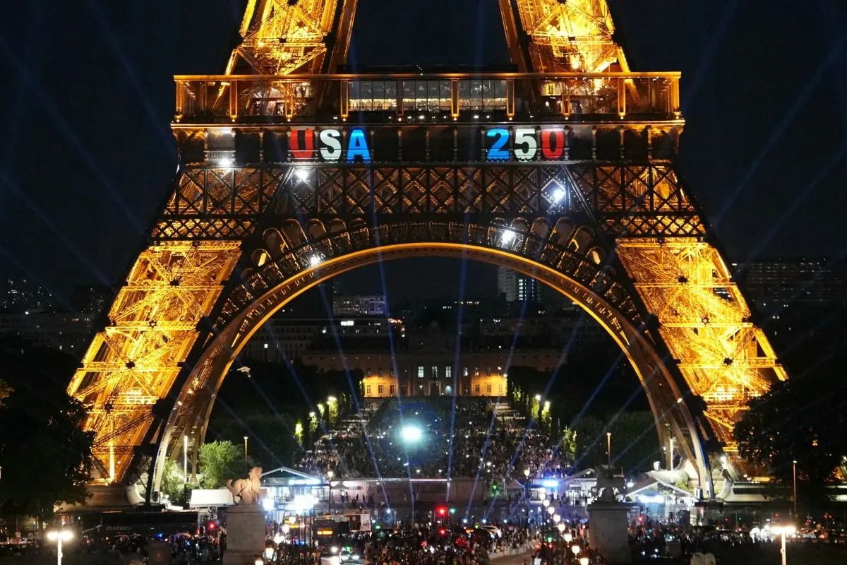 Man climbs Eiffel Tower and hangs US flag on America's big birthday