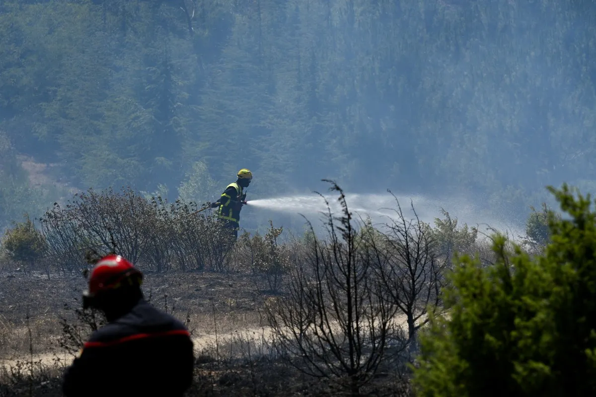 Scores of firefighters tackle multiple wildfires in Dordogne