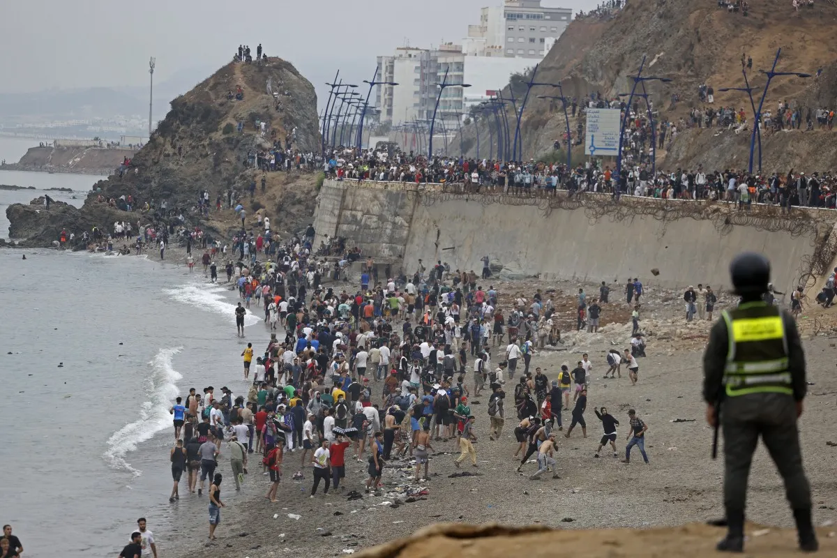 Thousands cross from Morocco into Spain’s Ceuta as officials report deaths