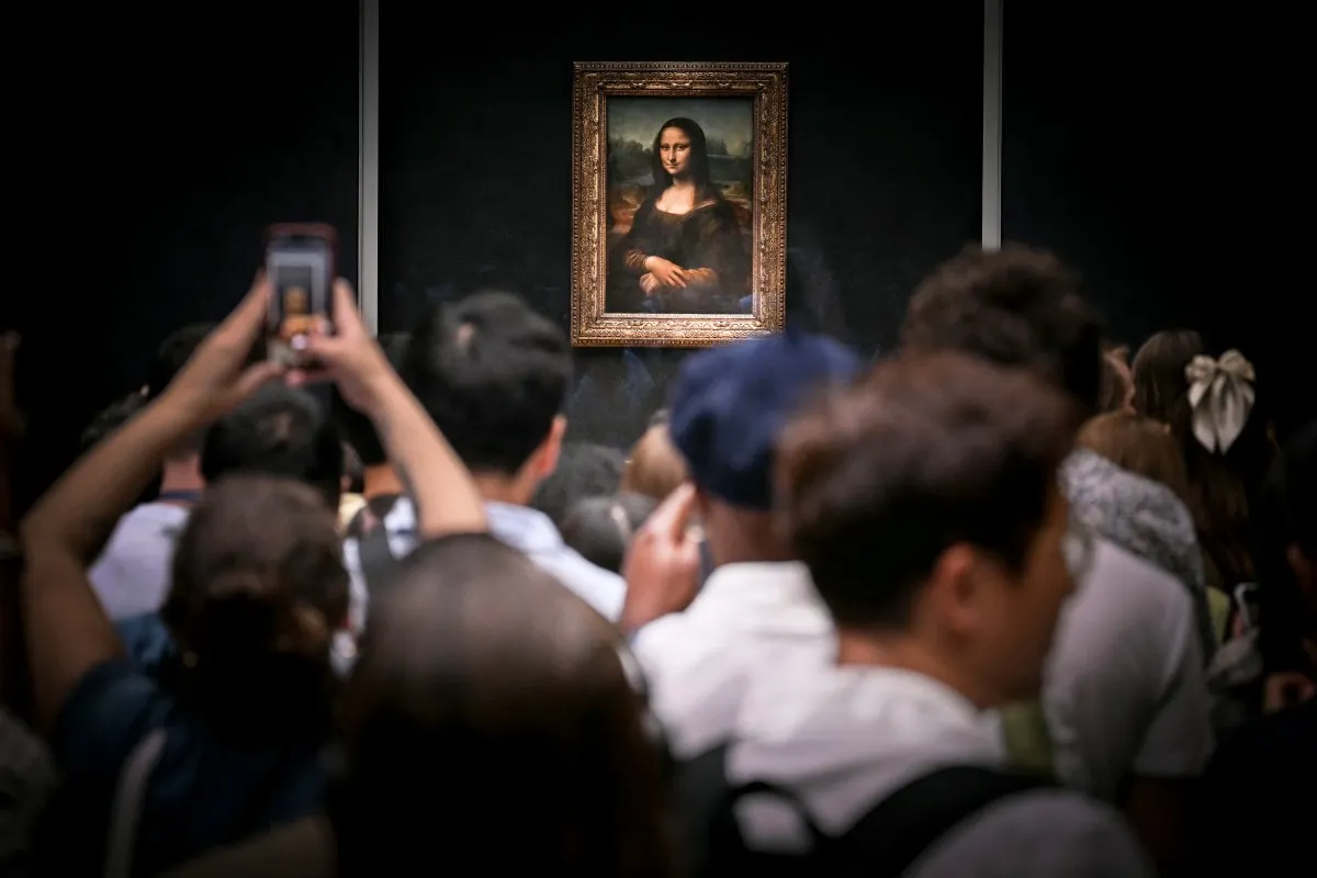 Two Germans arrested after Louvre Mona Lisa hall stunt with paintings