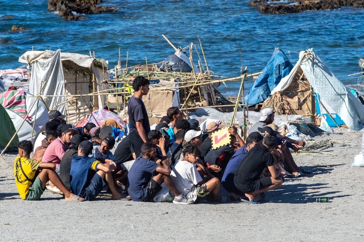 Spanish police move hundreds of migrants in Ceuta from beaches to port-area camp