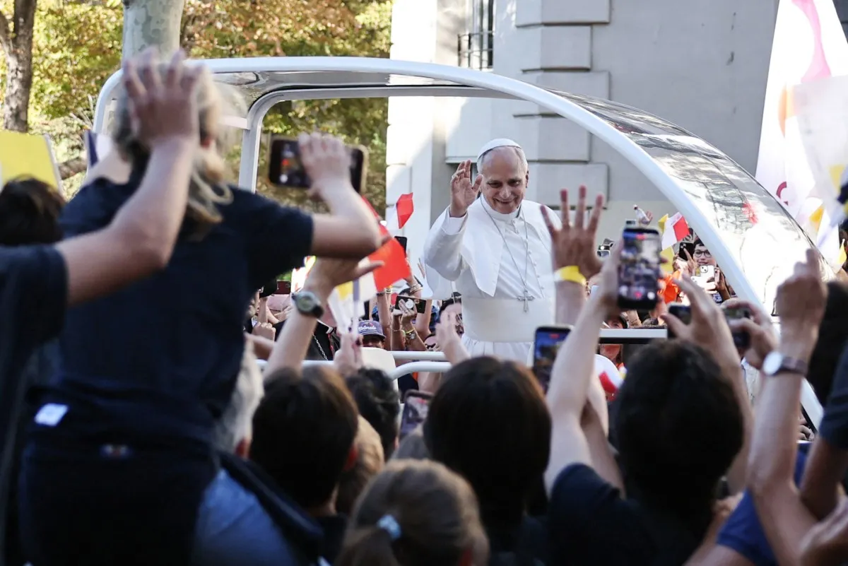 Pope Leo XIV greets crowds during popemobile ride through Paris