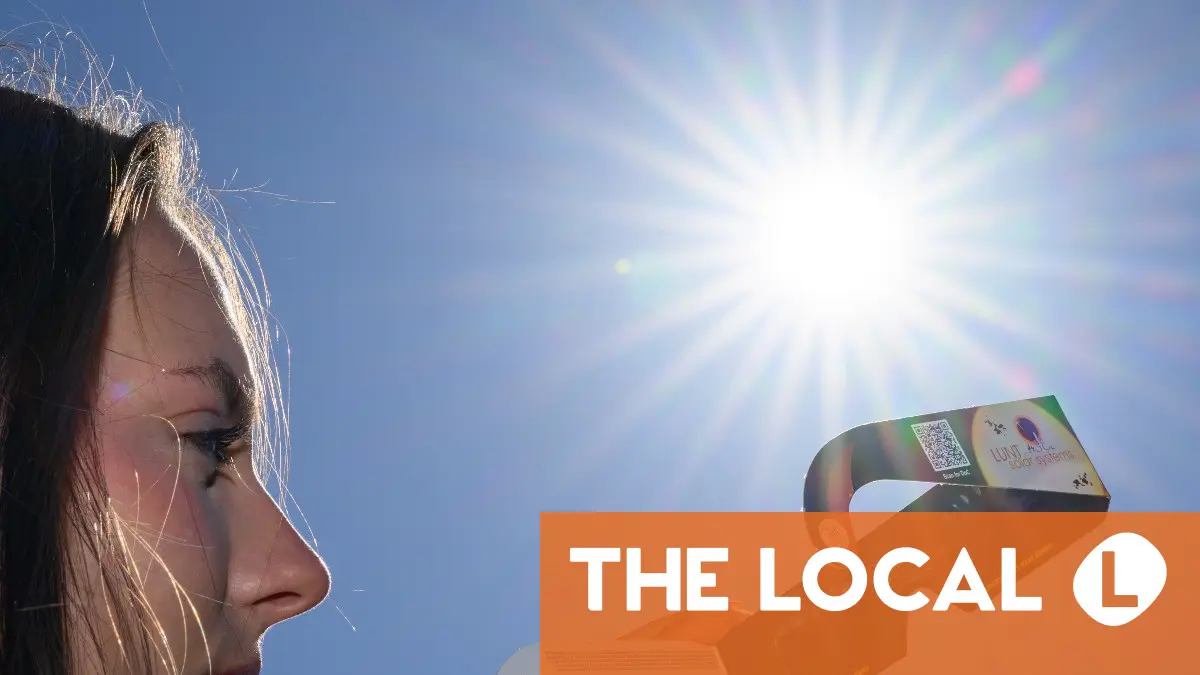 Profile of a person looking up at a bright sun with a news logo in the corner.