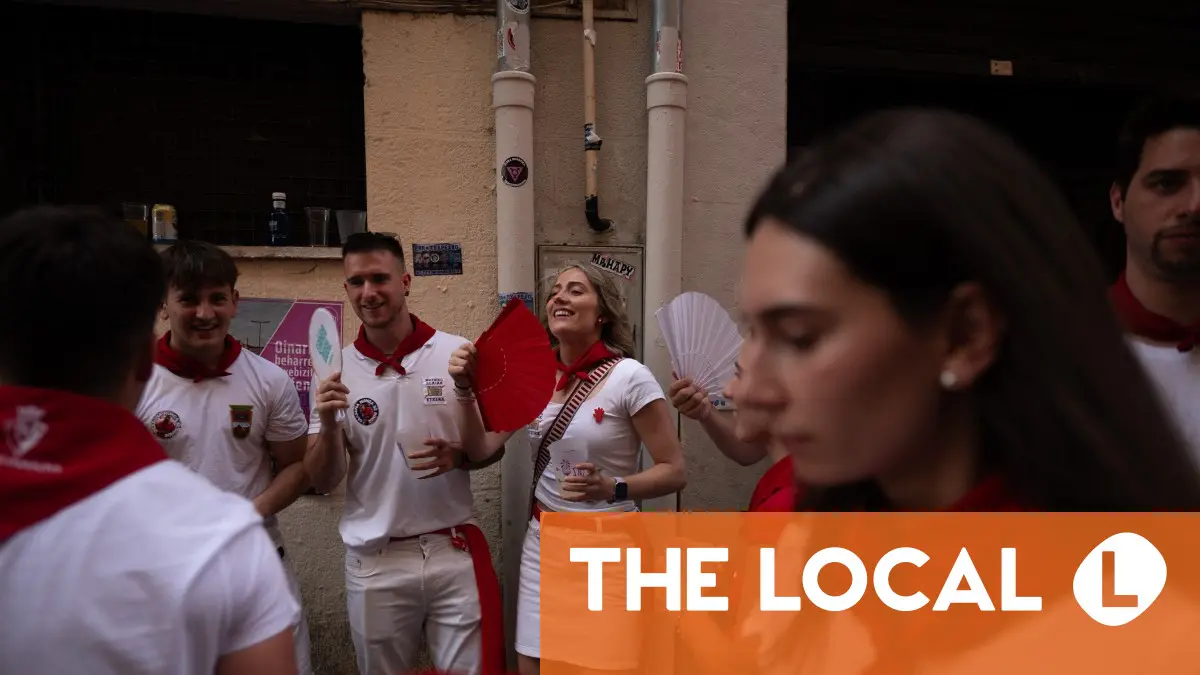 A group of people gathered outdoors in front of a building.