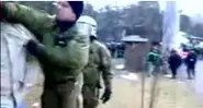 Policeman suspended after punching football fan on film