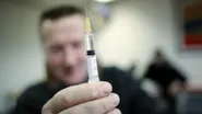 Junkie holds up cash machine locations with needle