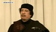 Merkel demands Qaddafi step down immediately