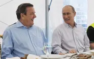 Schröder backs up old friend Putin