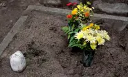 Graverobber 'blackmailed woman with son's ashes'