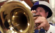 Busker bashes passenger with trumpet