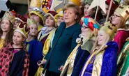 Merkel appears at carol concert on crutches