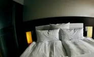 Naked woman removed from stranger's bed