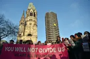 Refugees, Berliners sing together against hate at attack site