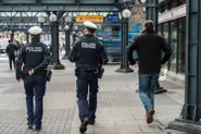 Wanted man caught by cops after urinating outside police station