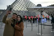 Hundreds queue at Louvre museum as strike vote delays opening